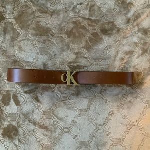 Brown leather Calvin Klein size 32 belt with signature CK silver buckle NWT